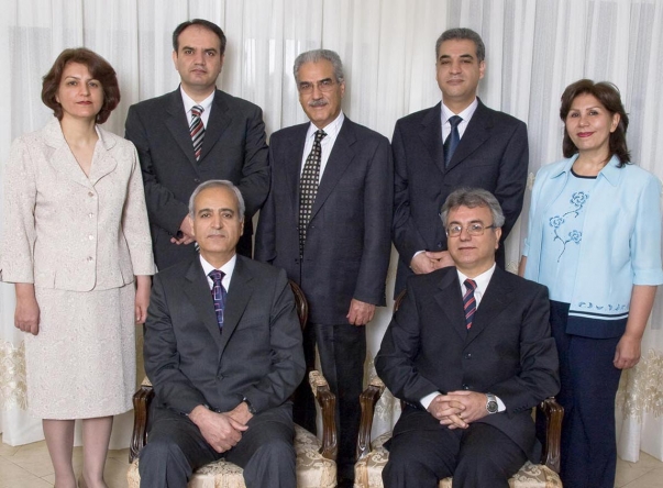 Photo of the seven imprisoned Baha’i leaders; seated from left, Behrouz Tavakkoli and Saeid Rezaie, and standing, Fariba Kamalabadi, Vahid Tizfahm, Jamaloddin Khanjani, Afif Naemi and Mahvash Sabet.