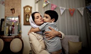 Nasrin Sotoudeh with her son, Nima, after being freed from prison last year. Photograph: Behrouz Mehri/AFP/Getty Images