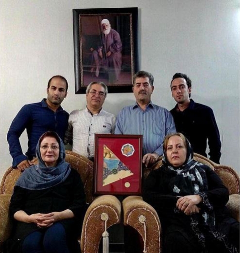 A group of Iranian Baha’is received the fragment of artwork on behalf of the Baha’is of Iran.