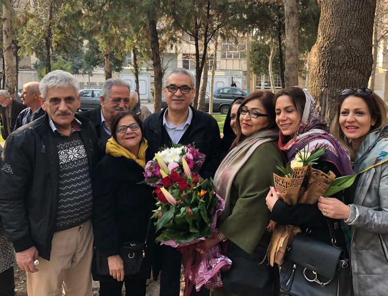 Afif Naeimi (center) stands with loved ones in Tehran earlier today after completing his unjust 10-year prison sentence.