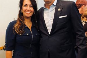 Soheila Abbassi, a member of a Baha’i delegation, poses with Rep. Harley Rouda at a Dec. 14, 2019, town hall meeting. Photo courtesy of Susan Fothergill