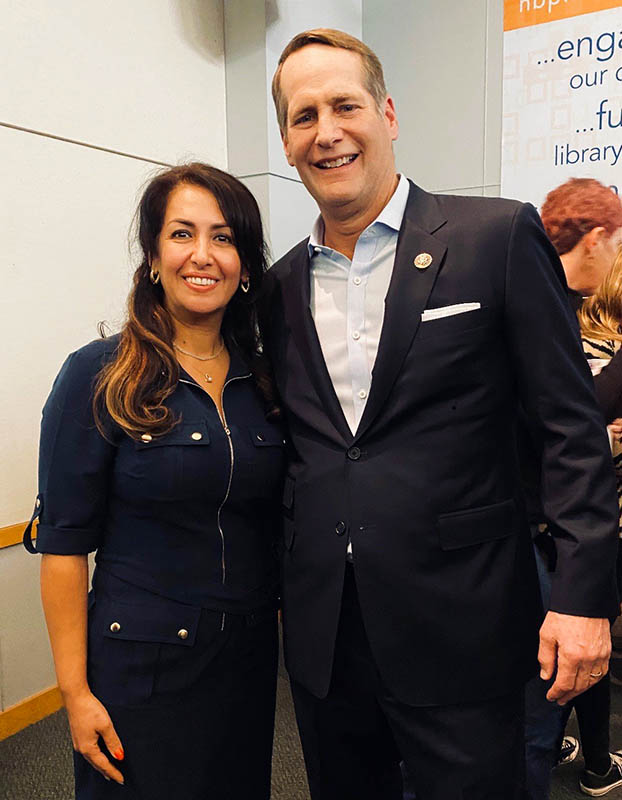 Soheila Abbassi, a member of a Baha’i delegation, poses with Rep. Harley Rouda at a Dec. 14, 2019, town hall meeting. Photo courtesy of Susan Fothergill