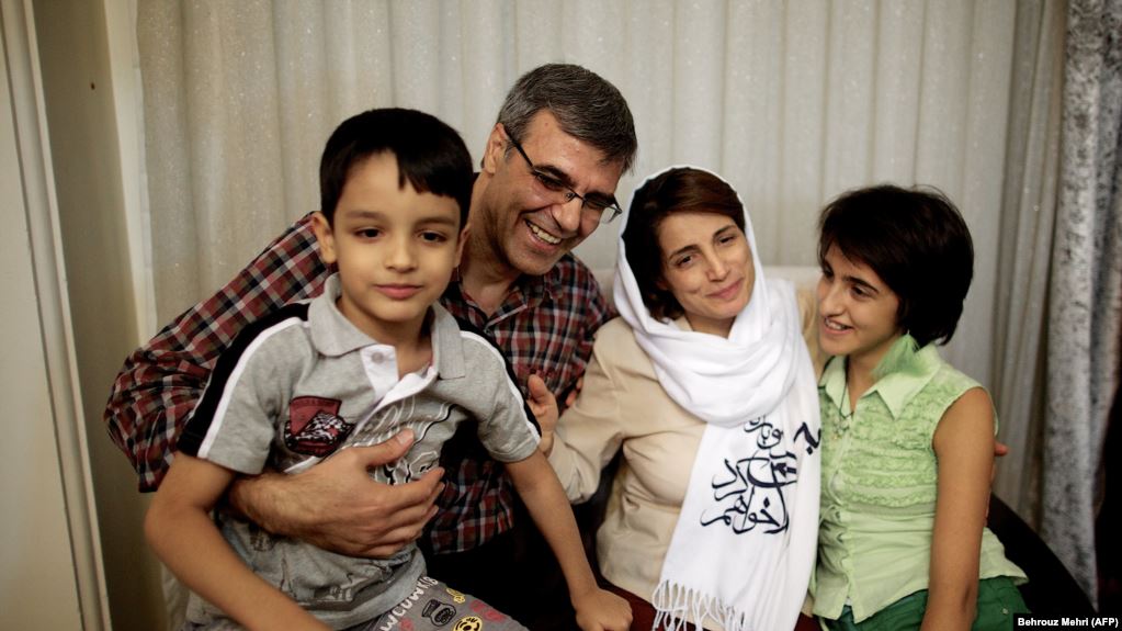 Nasrin Sotoudeh (second from right) poses with her husband, Reza Khandan, her son Nima, and her daughter Mehraveh at her house in Tehran in September 2013.