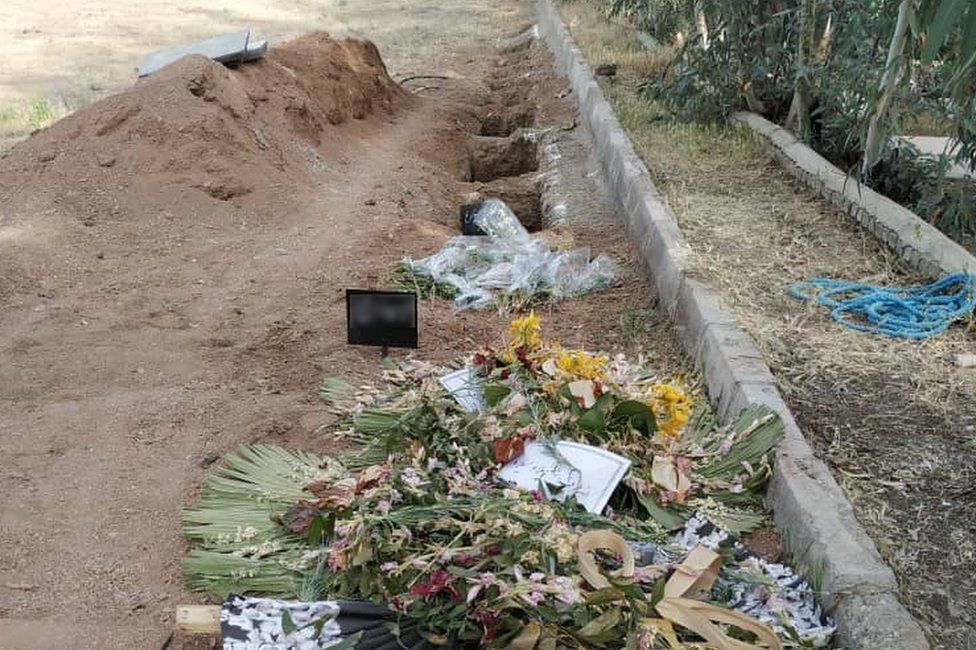 Recent photographs showed freshly dug plots at the site of the mass grave